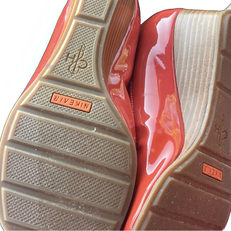 Recycle Me Fancy Cole Haan Nike Air coral red patent leather wedge flats showing the textured rubber soles