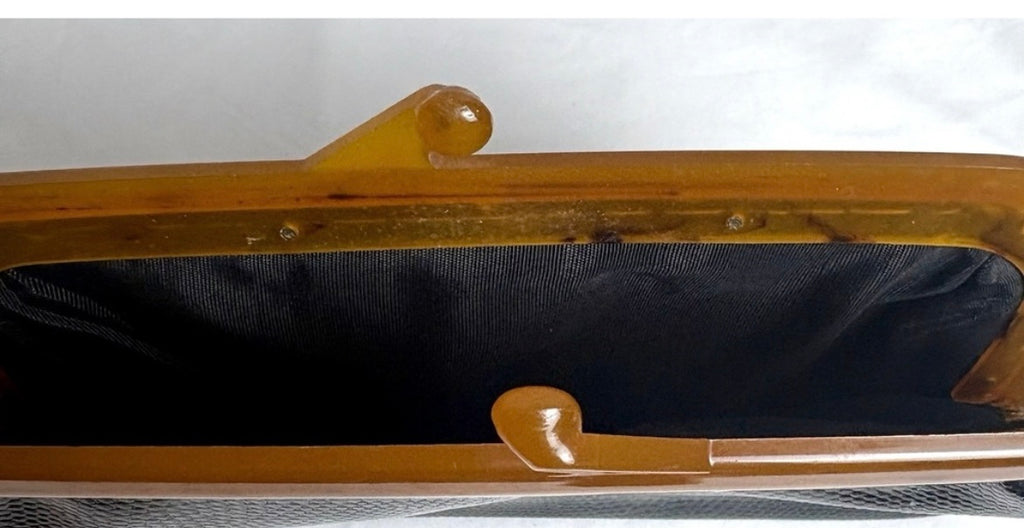 Vintage amber kisslock frame clutch open view