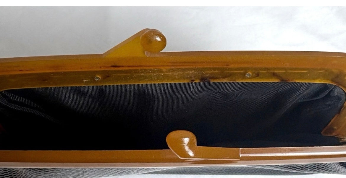 Vintage amber kisslock frame clutch open view