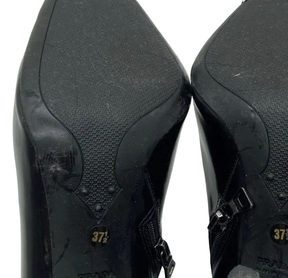 Prada black ankle booties soles showing size 37.5 and Prada Made in Italy stamp