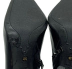 Prada black ankle booties soles showing size 37.5 and Prada Made in Italy stamp