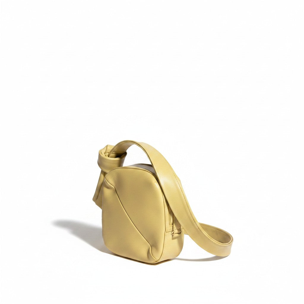 Recycle Me Fancy pre-loved Anthropologie yellow shoulder bag with a minimalist knotted strap design