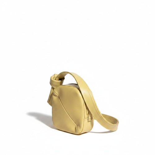 Recycle Me Fancy pre-loved Anthropologie yellow shoulder bag with a minimalist knotted strap design