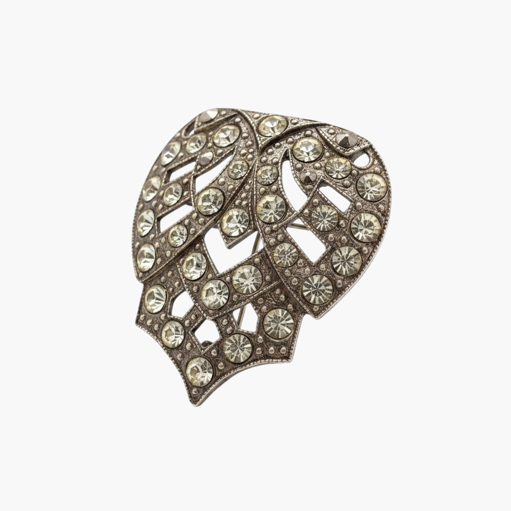 Recycle Me Fancy vintage Art Deco shield brooch with black enamel, geometric patterns, and clear pavé rhinestones.