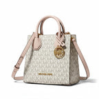 Recycle Me Fancy Michael Kors Mercer mini tote in signature MK logo print with cream leather trim and gold MK charm.
