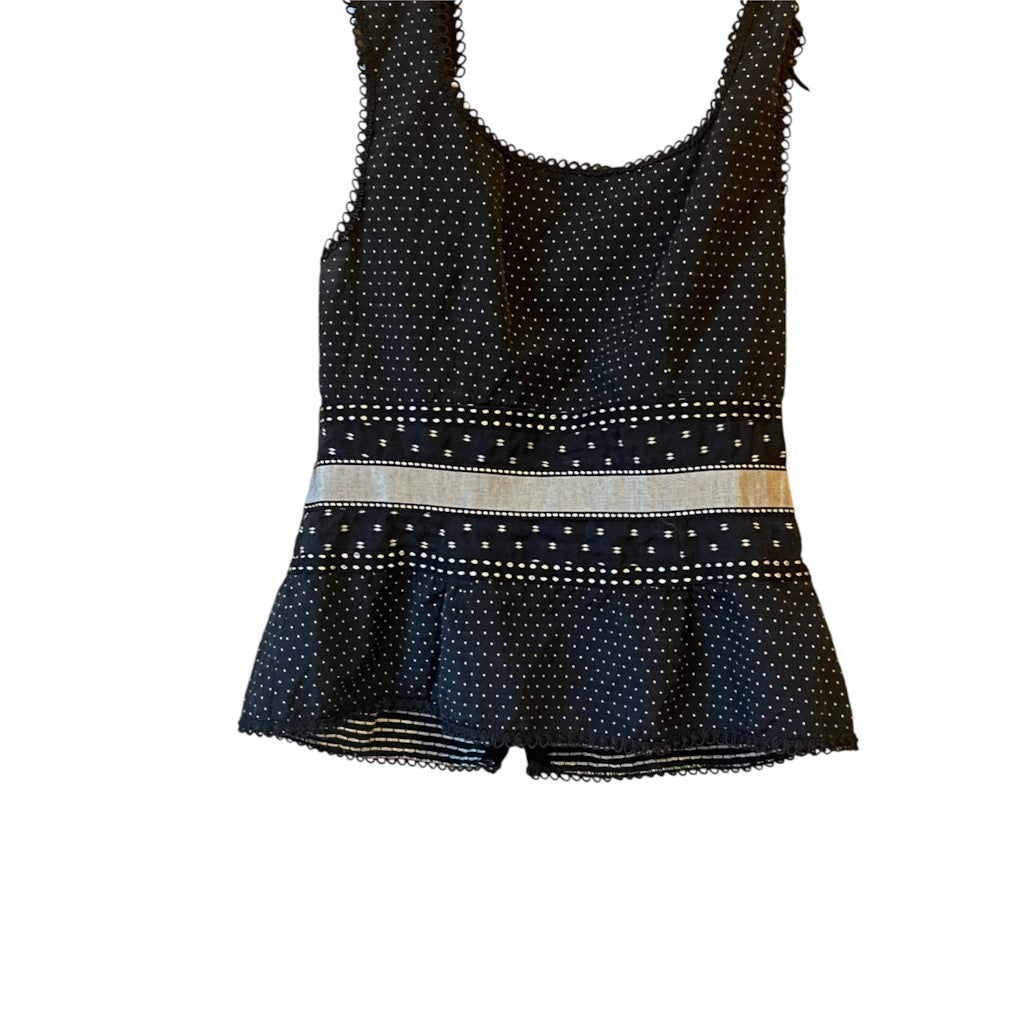 Recycle Me Fancy Nanette Lepore black silk peplum top with white polka dots, scalloped lace trim, and ribbon waistband.