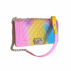 Recycle Me Fancy rainbow ombre quilted jelly crossbody bag with a gold-tone chain strap and twist-lock closure.