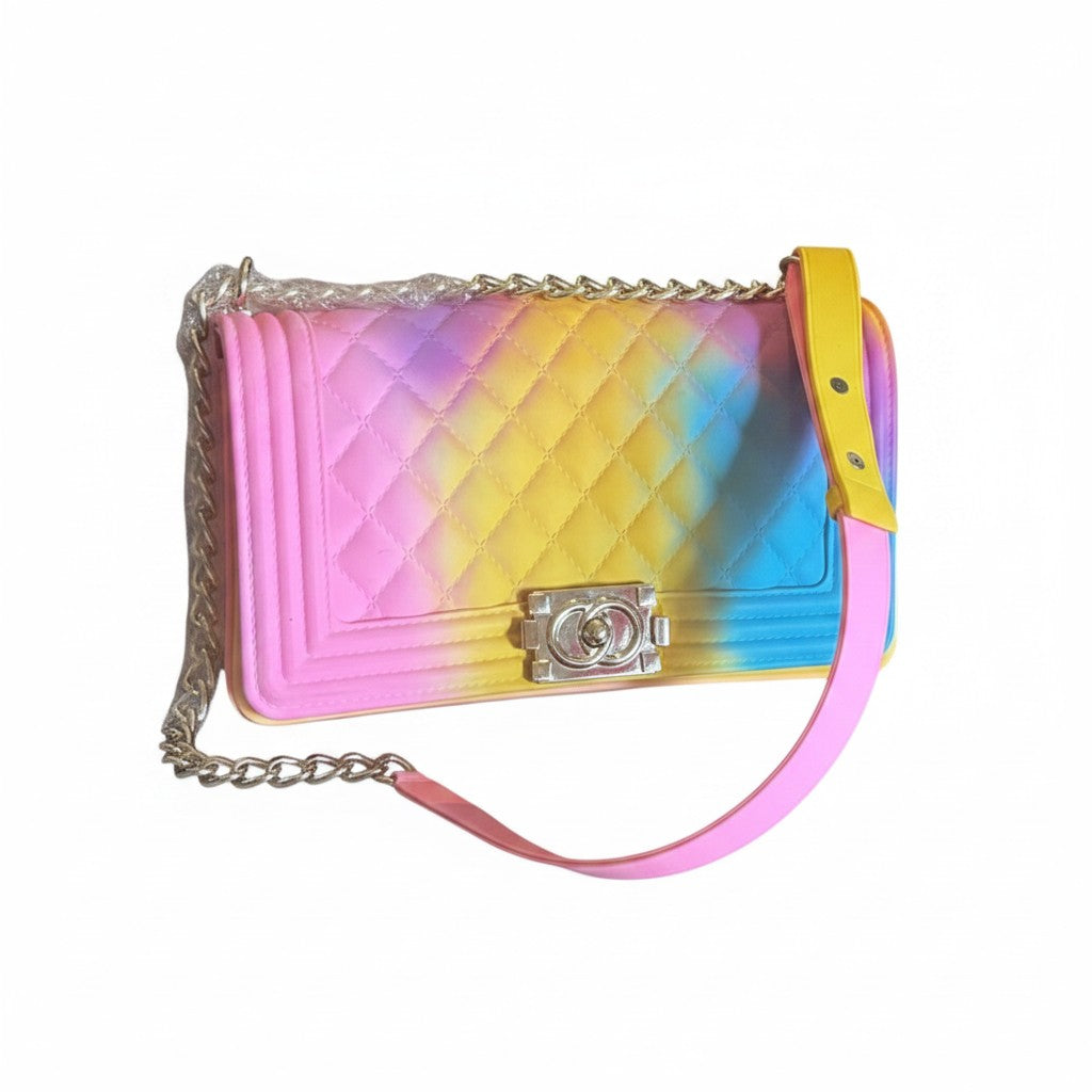Recycle Me Fancy rainbow ombre quilted jelly crossbody bag with a gold-tone chain strap and twist-lock closure.