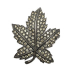 Recycle Me Fancy vintage silver-tone maple leaf brooch with clear pavé-set rhinestones on a metal base.