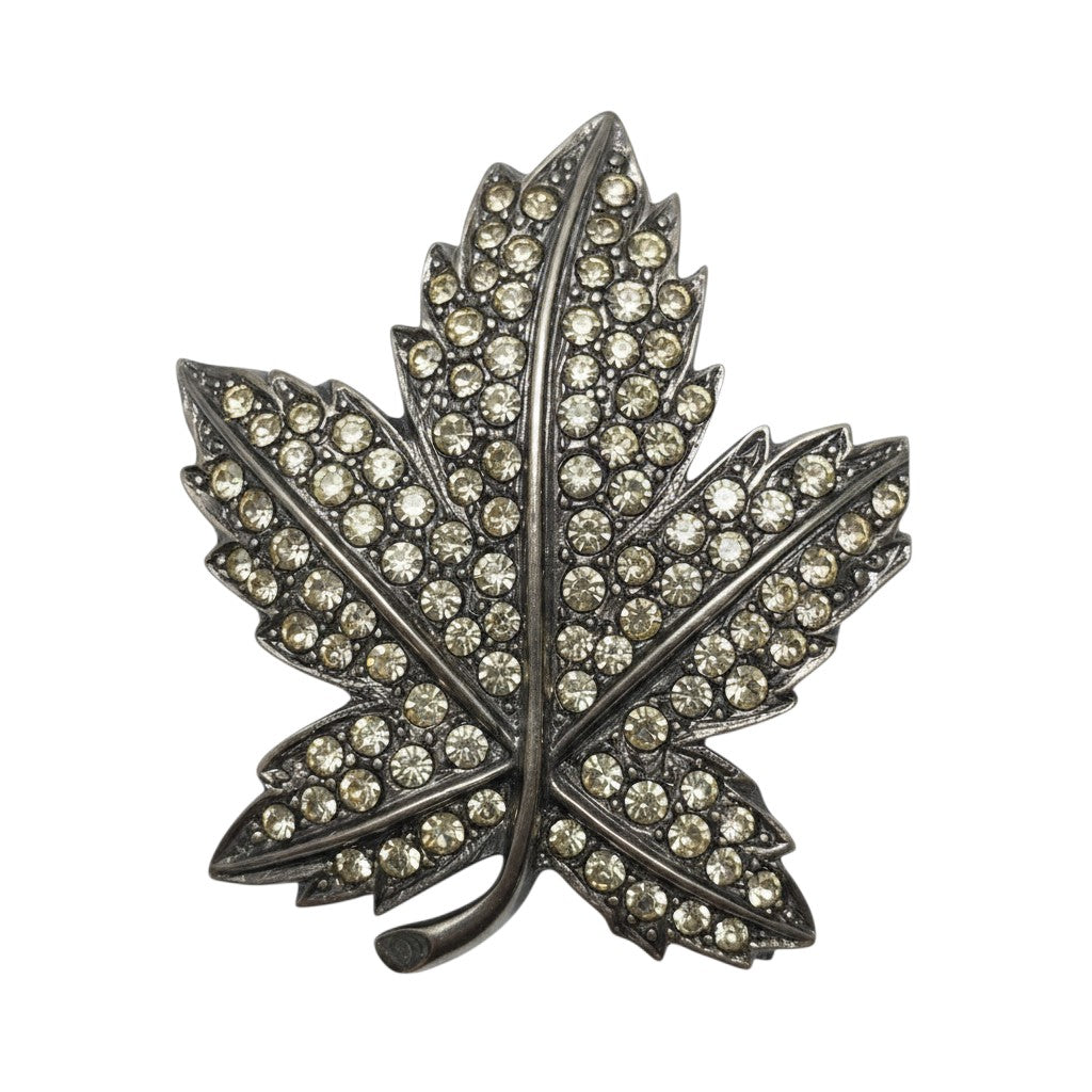 Recycle Me Fancy vintage silver-tone maple leaf brooch with clear pavé-set rhinestones on a metal base.
