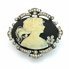 Recycle Me Fancy vintage cameo brooch featuring a cream profile on black with a silver-tone seed pearl bow frame.