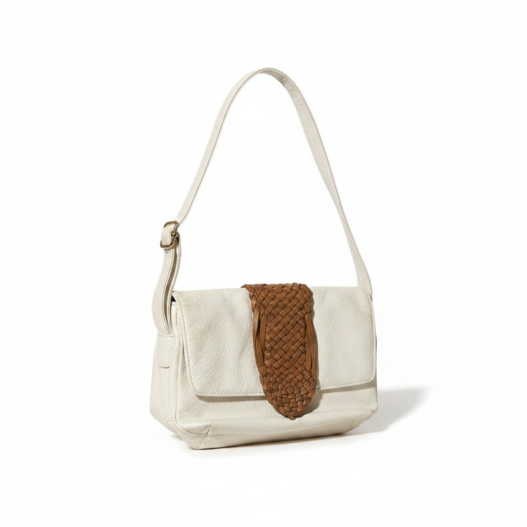 Recycle Me Fancy vintage white leather crossbody bag with a woven tan leather flap detail and adjustable strap.