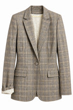 Front of vintage neutral plaid blazer with polka dot lining